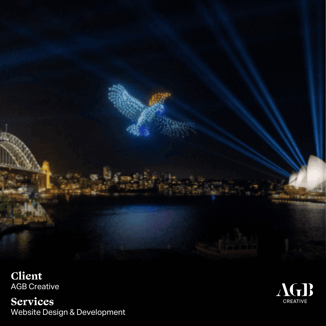 A spectacular drone light show in the shape of a bird, illuminating the night sky over Sydney Harbour with the Sydney Opera House and Harbour Bridge in the background. Client: AGB Creative, Services: Website Design & Development.