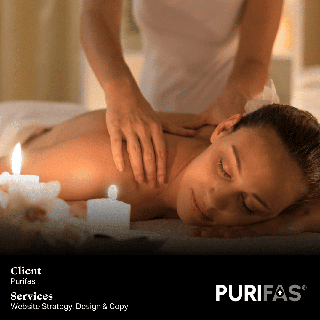 A serene spa scene with a woman receiving a relaxing massage in a softly lit room surrounded by candles. Client: Purifas, Services: Website Strategy, Design & Copy.